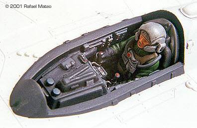 A detailed model of a pilot in the cockpit of a plane.
